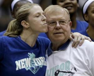 Her father stands by her side during her final home game with the New York Liberty (Associated Press Photo by Julio Cortez)