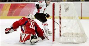 Scoring a first period goal against Nadezhda Aleksandrova of Russia at the 2006 Torino Winter Games. (Image obtained from: http://www.windsorstar.com/Gallery+Meghan+Agosta/1278824/story.html Agosta) 