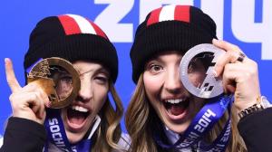 Celebrating their medal win as Justine and Chloe become the first Canadian siblings to win medals in the same event in Winter Games history. Photo credit: Nathan Denette/The Canadian Press  